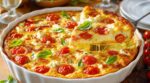 Ce clafoutis aux tomates cerises rend fous mes invités : ce geste avec le fromage le fait littéralement fondre